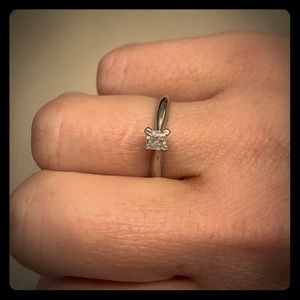 1/4 Carat 14K White gold princess cut solitaire.
